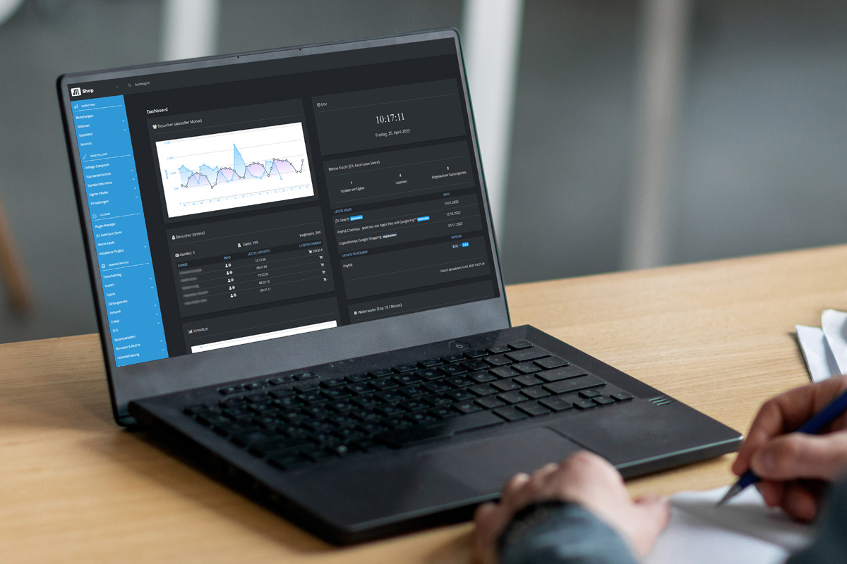 Dashboard der JTL Shop Software auf einem schwarzen Laptop.